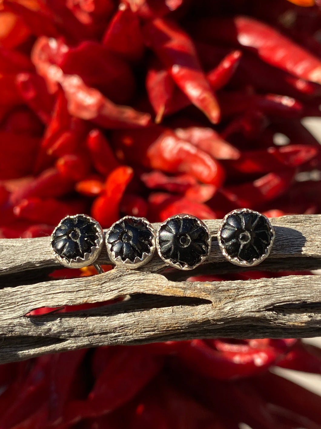 Carved black onyx flower studs